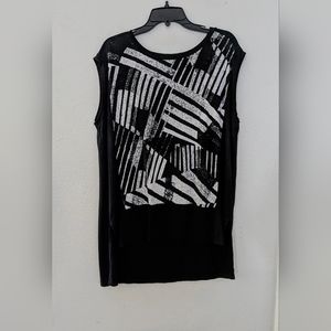 oversized black sleeveless top with abstract design.